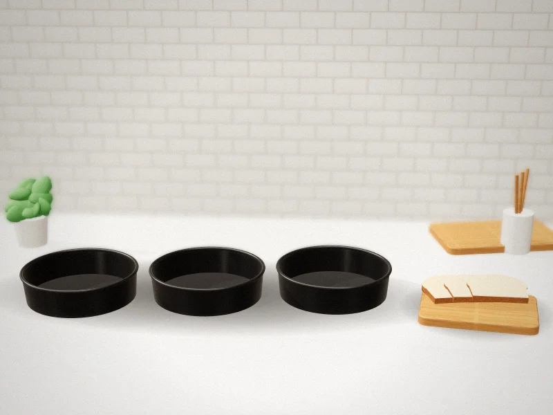 8 Inch Cake Pan 3-Piece Carbon Steel Set with 100 Parchment Rounds in a home kitchen